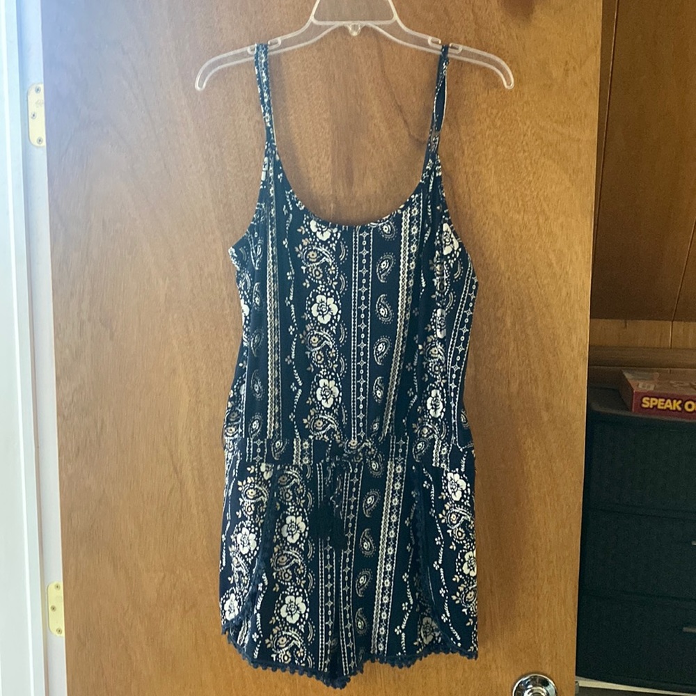 Navy floral spaghetti strap romper.